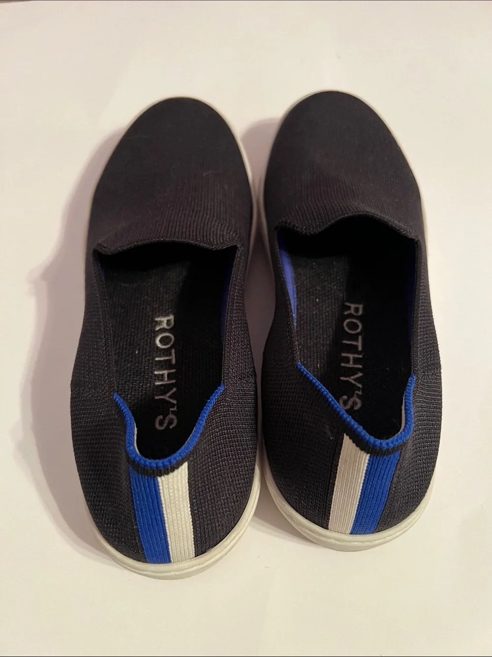 Rothy's Women’s Black Slip-On Sneakers Size 8 with Blue & White Stripe Accent